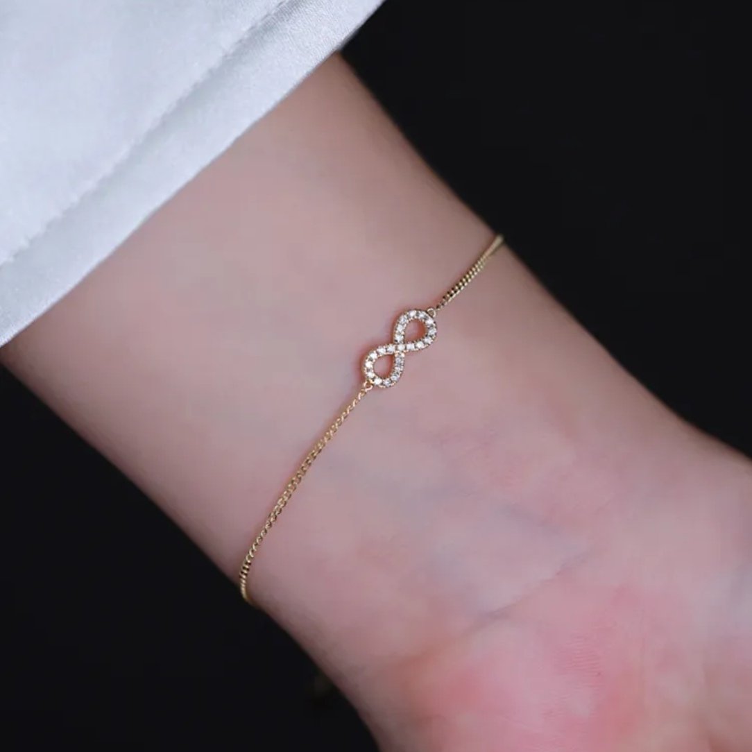 Infinity symbol bracelets with diamonds